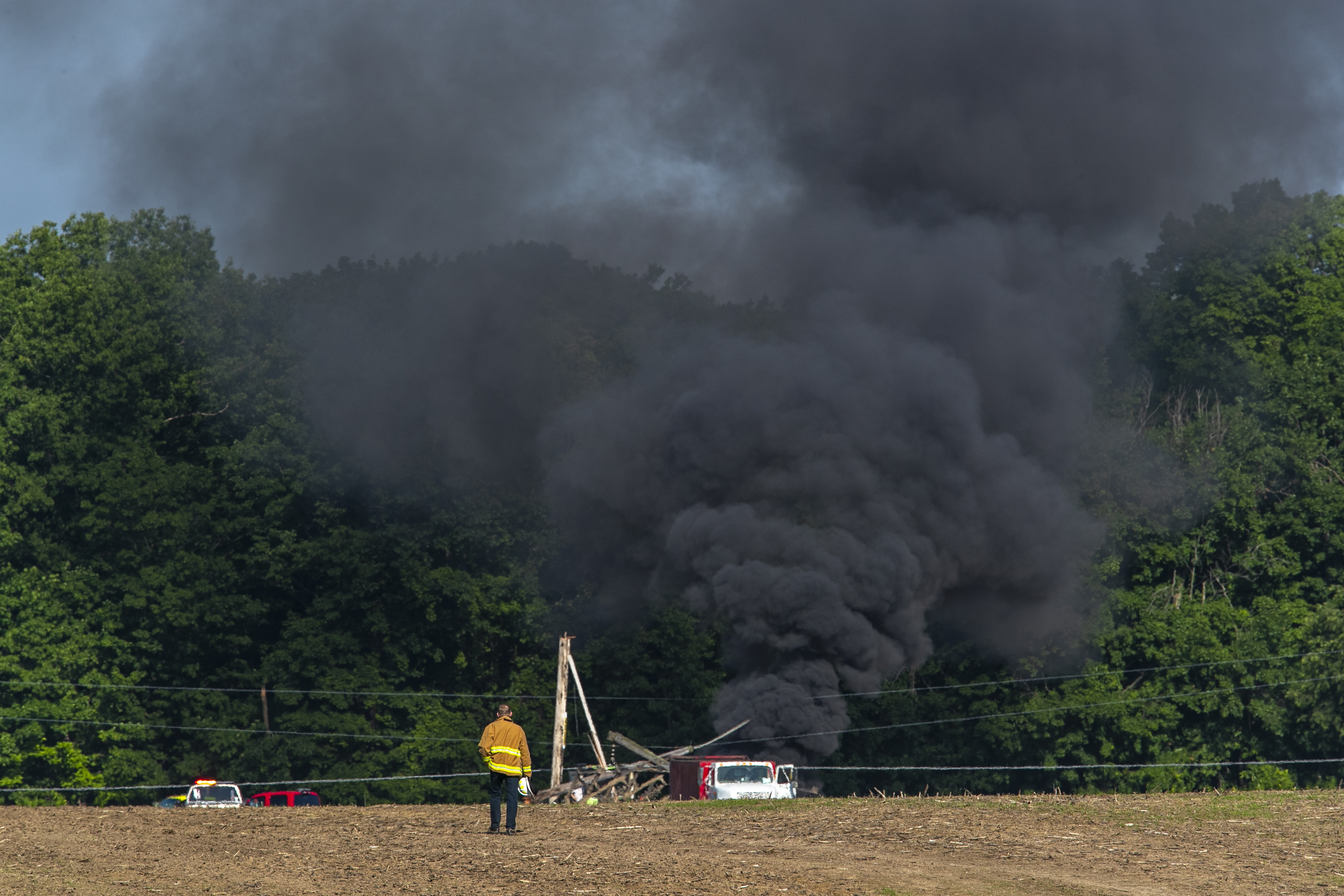 Farmer trapped after power lines fall on tractor - mlive.com