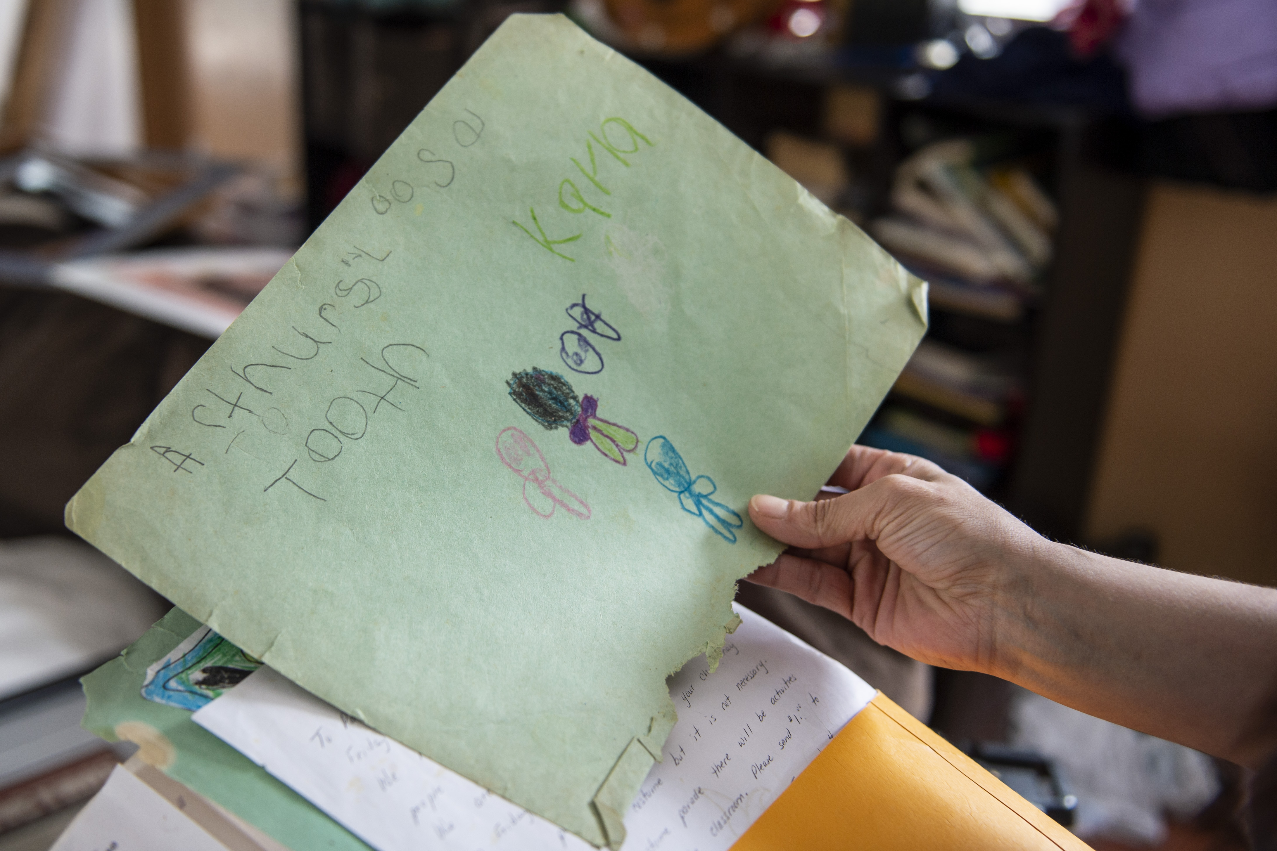 Elizabeth Krasinski still hangs onto her late sister's artwork in Tawas City on Thursday, Feb. 20, 2020. Elizabeth lost her sister, Kayla Rolland, 20 years ago in a school shooting when Rolland was only in first grade. In 2000, the story made national news as Rolland is amongst the youngest of school shooting victims.