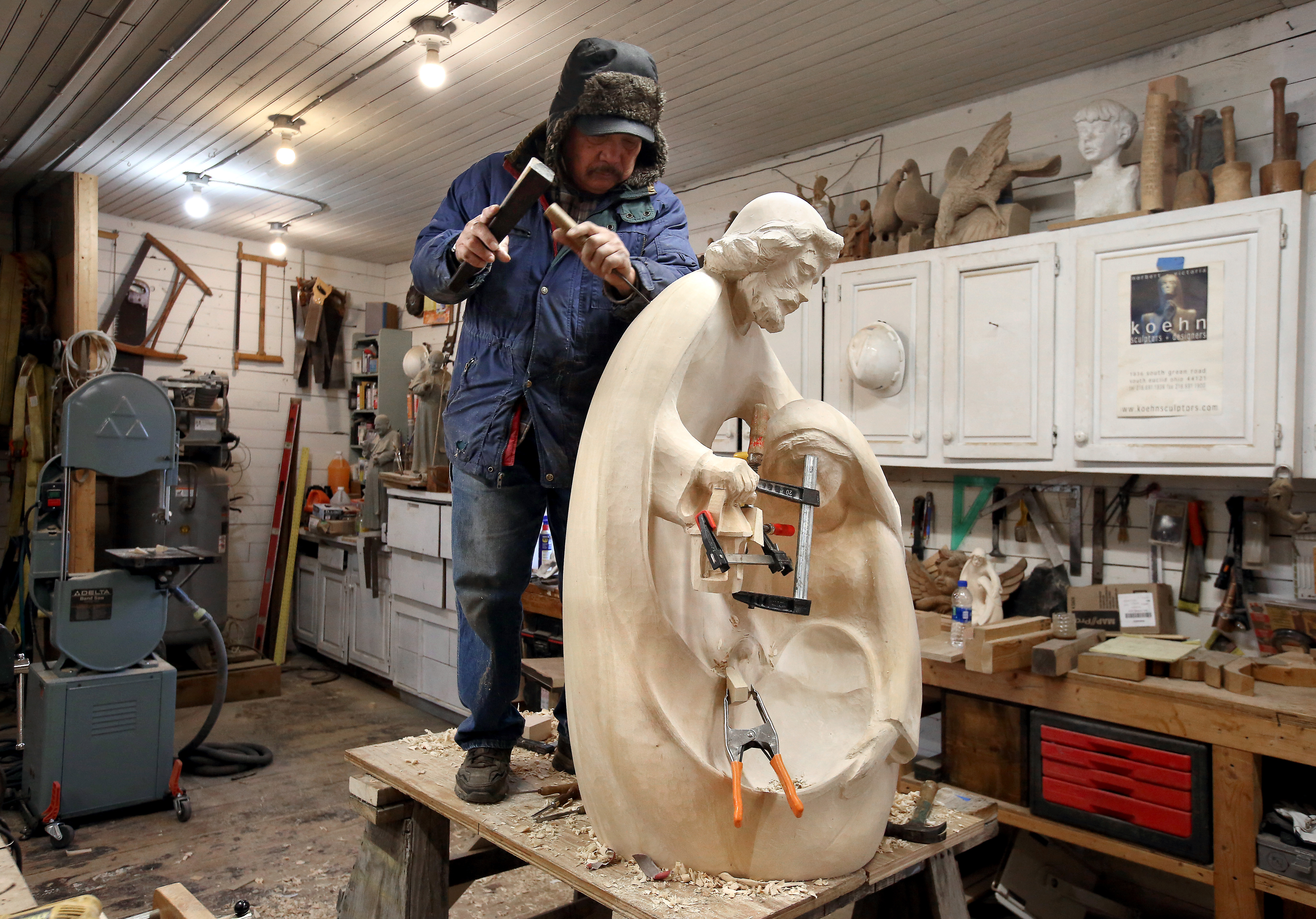 Sculptor Norbert Koehn carves statues for Christmas at The Koehn