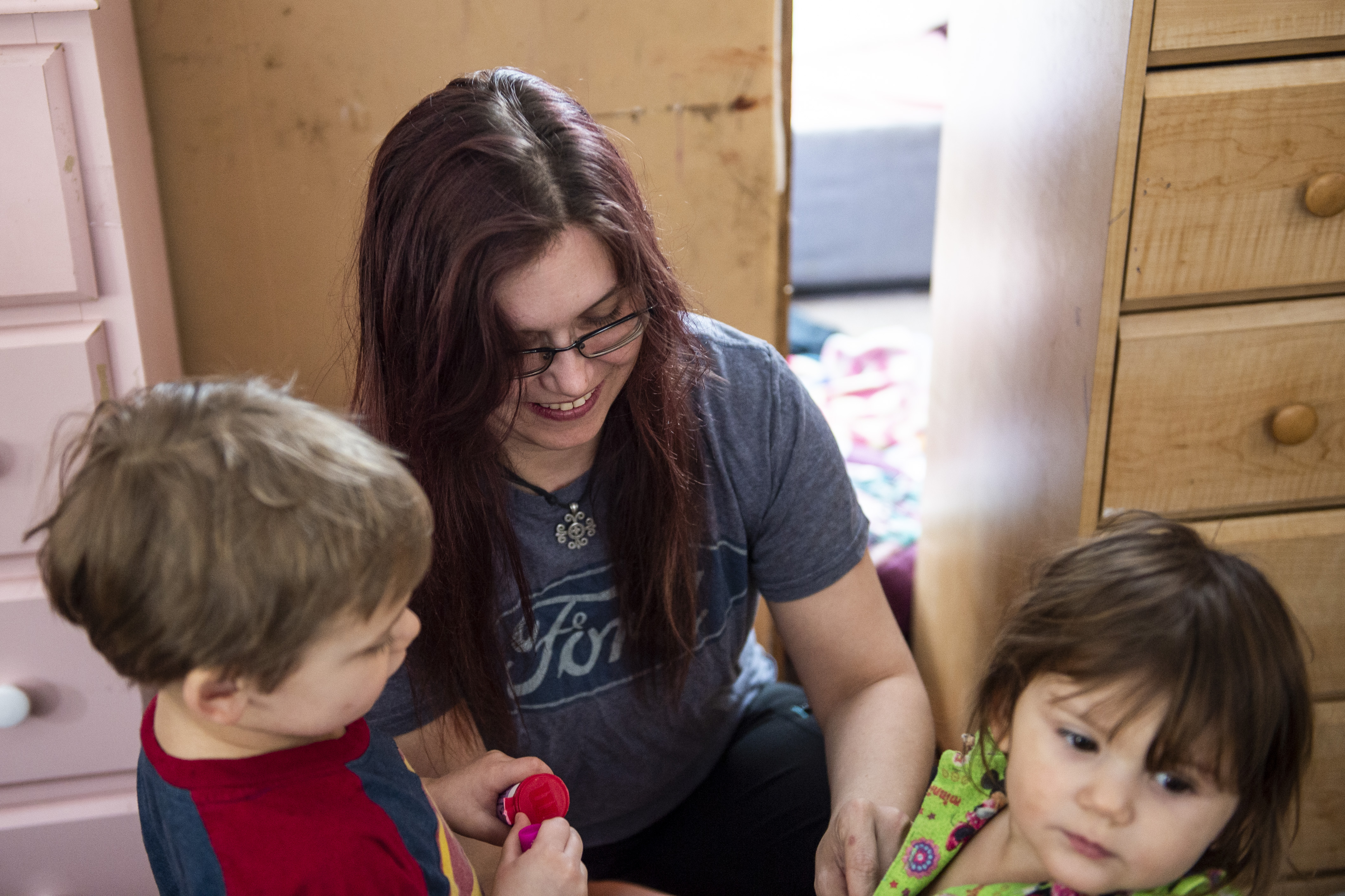 Elizabeth Krasinski helps her kids Daniel Kransinski Jr., 3, and Savannah Krasinski, 2, get dressed in Tawas City on Thursday, Feb. 20, 2020. Elizabeth lost her sister, Kayla Rolland, 20 years ago in a school shooting when Rolland was only in first grade. In 2000, the story made national news as Rolland is amongst the youngest of school shooting victims.