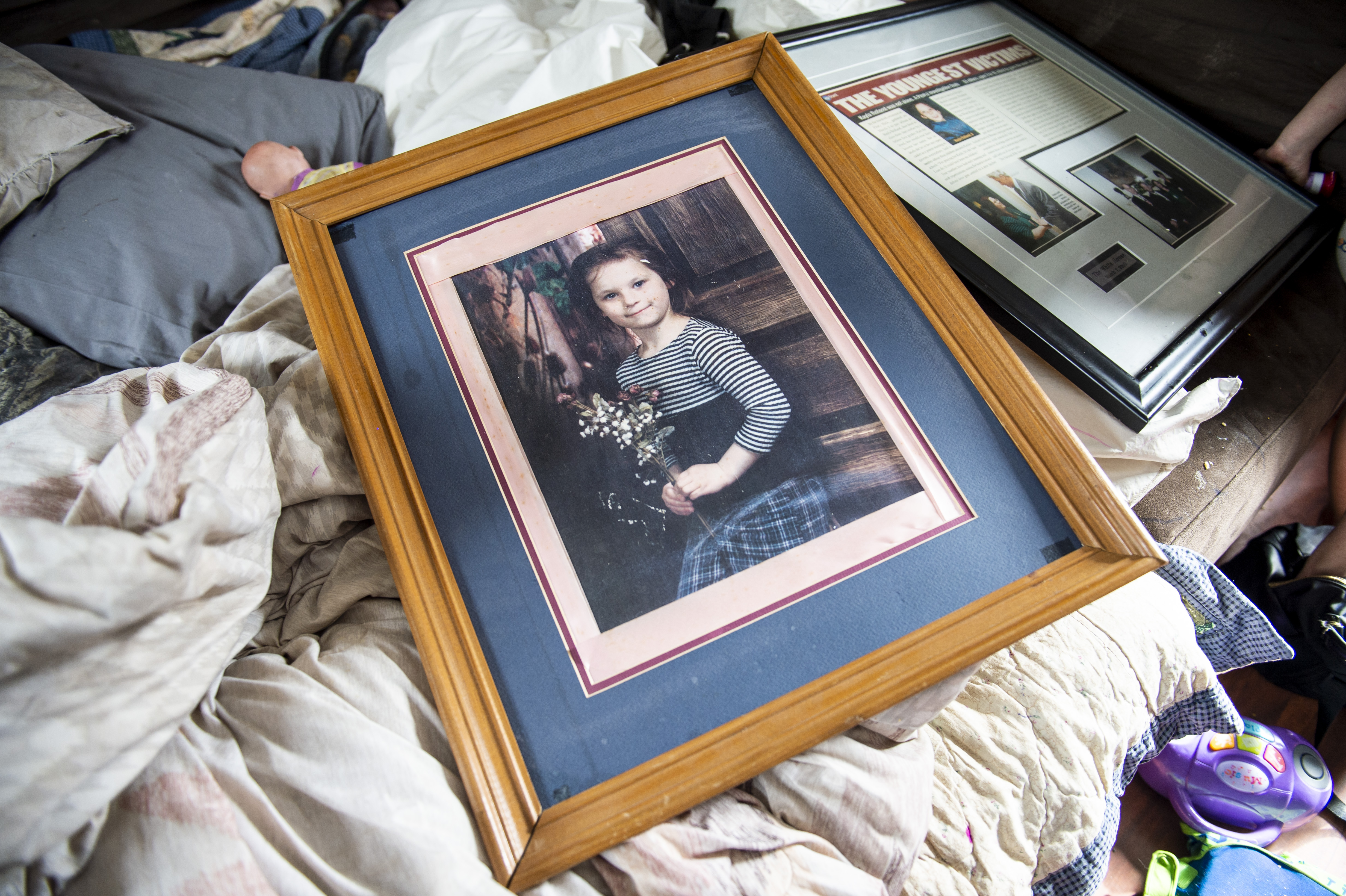 A look at a framed photograph that Elizabeth Krasinski keeps of her sister in Tawas City on Thursday, Feb. 20, 2020. Krasinski lost her sister, Kayla Rolland, 20 years ago in a school shooting when Rolland was only in first grade. In 2000, the story made national news as Rolland is amongst the youngest of school shooting victims.