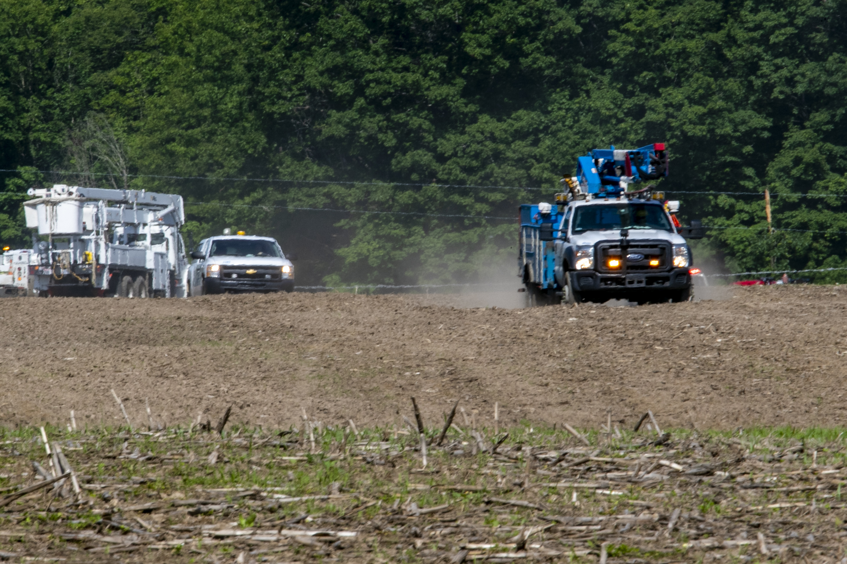 Farmer trapped after power lines fall on tractor - mlive.com