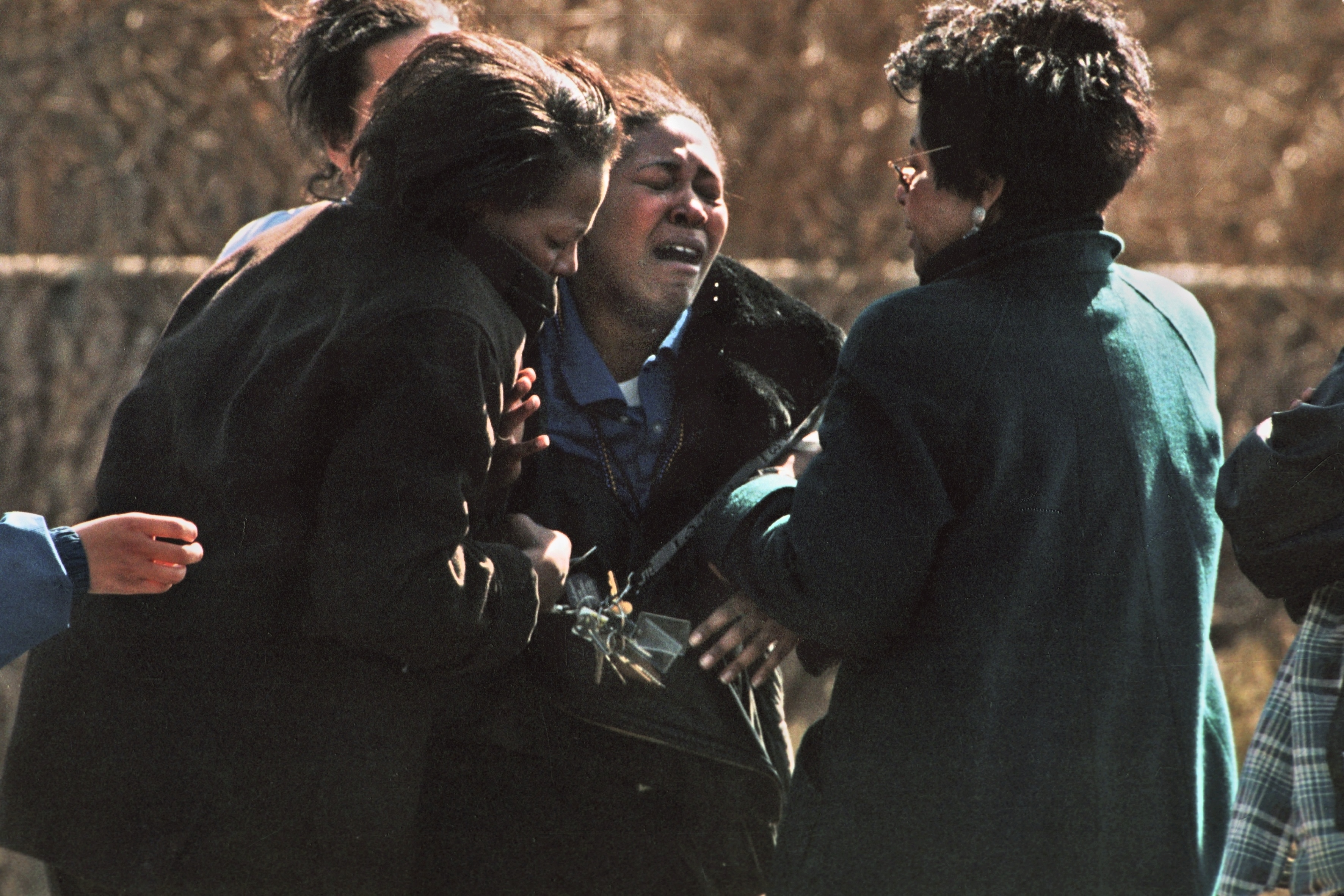 Tamarla Owens breaks down as she approaches the police lines outside of Buell Elementary School after learning her first grade son had shot and killed another first grader at the school in Mt. Morris Township on Tuesday, February 29, 2000. (Flint Journal File Photo by Steve Jessmore)