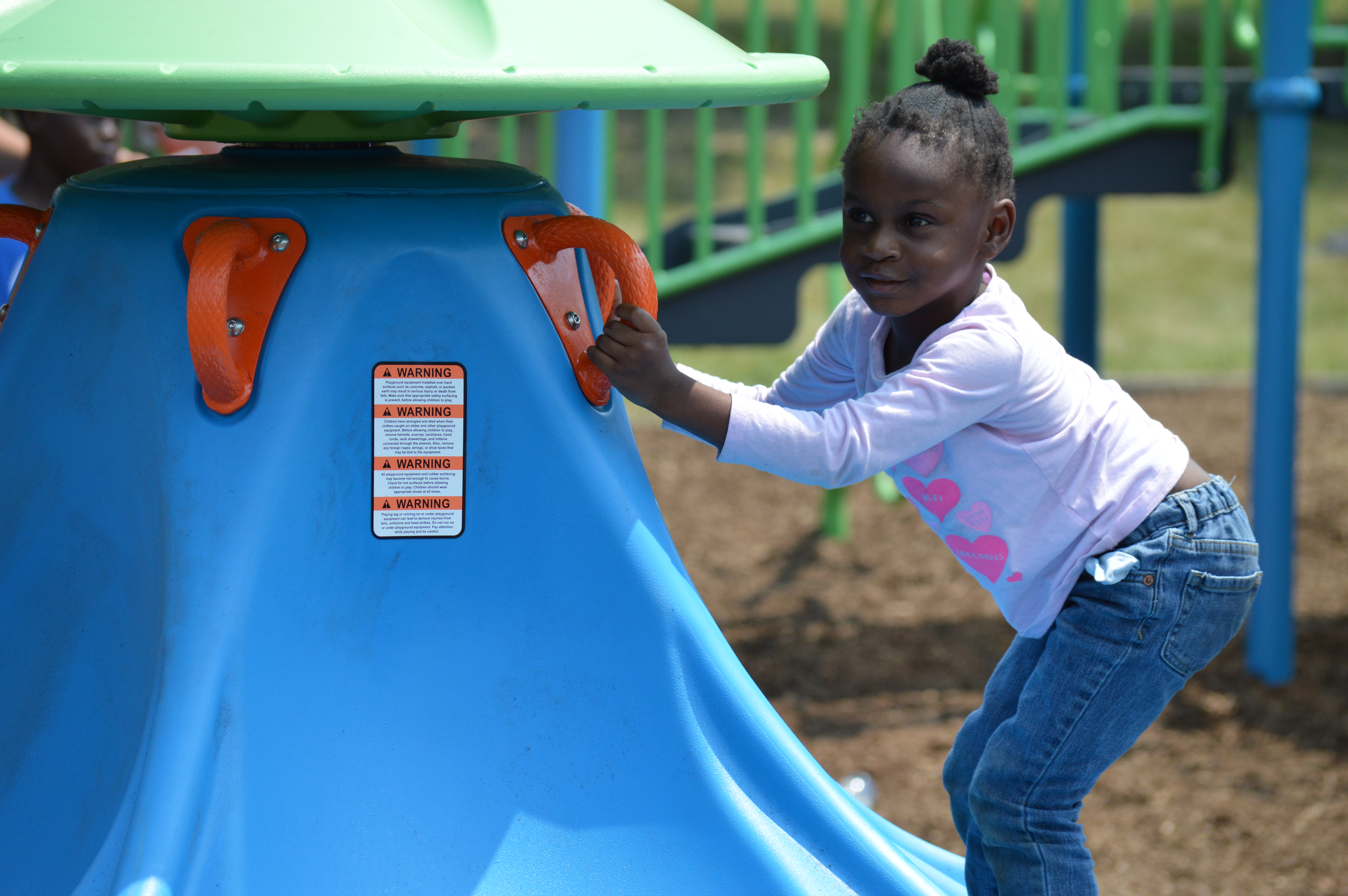 Kids Playing Tag On Playground