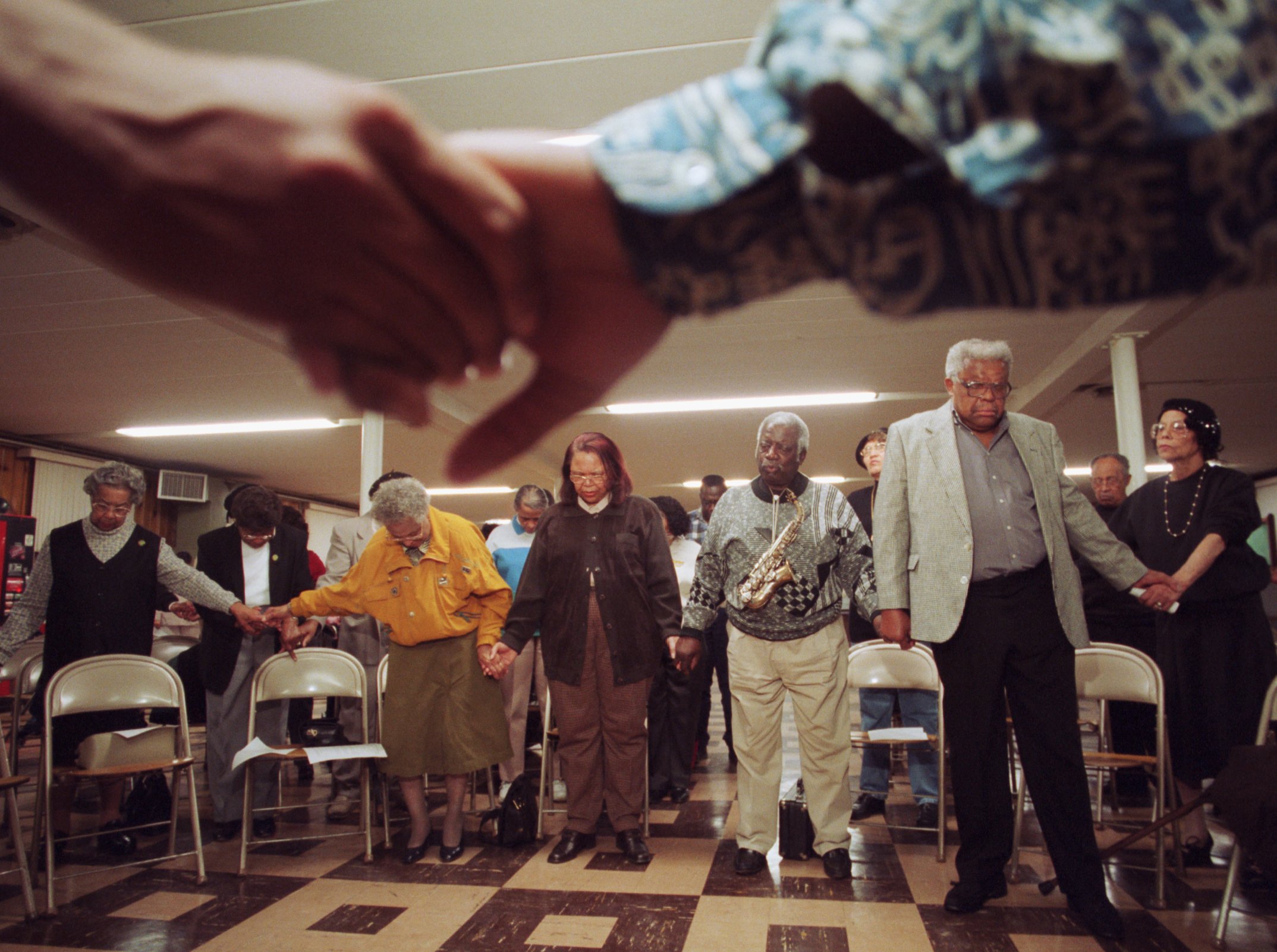 Prayer vigil in memory of shooting victim Kayla Rolland led by Rev. Richard Coleman at Quinn Chapel African Methodist Episcopal Church of Flint in Flint on Friday, March 3, 2000. (Flint Journal File Photo by Justin Warren)