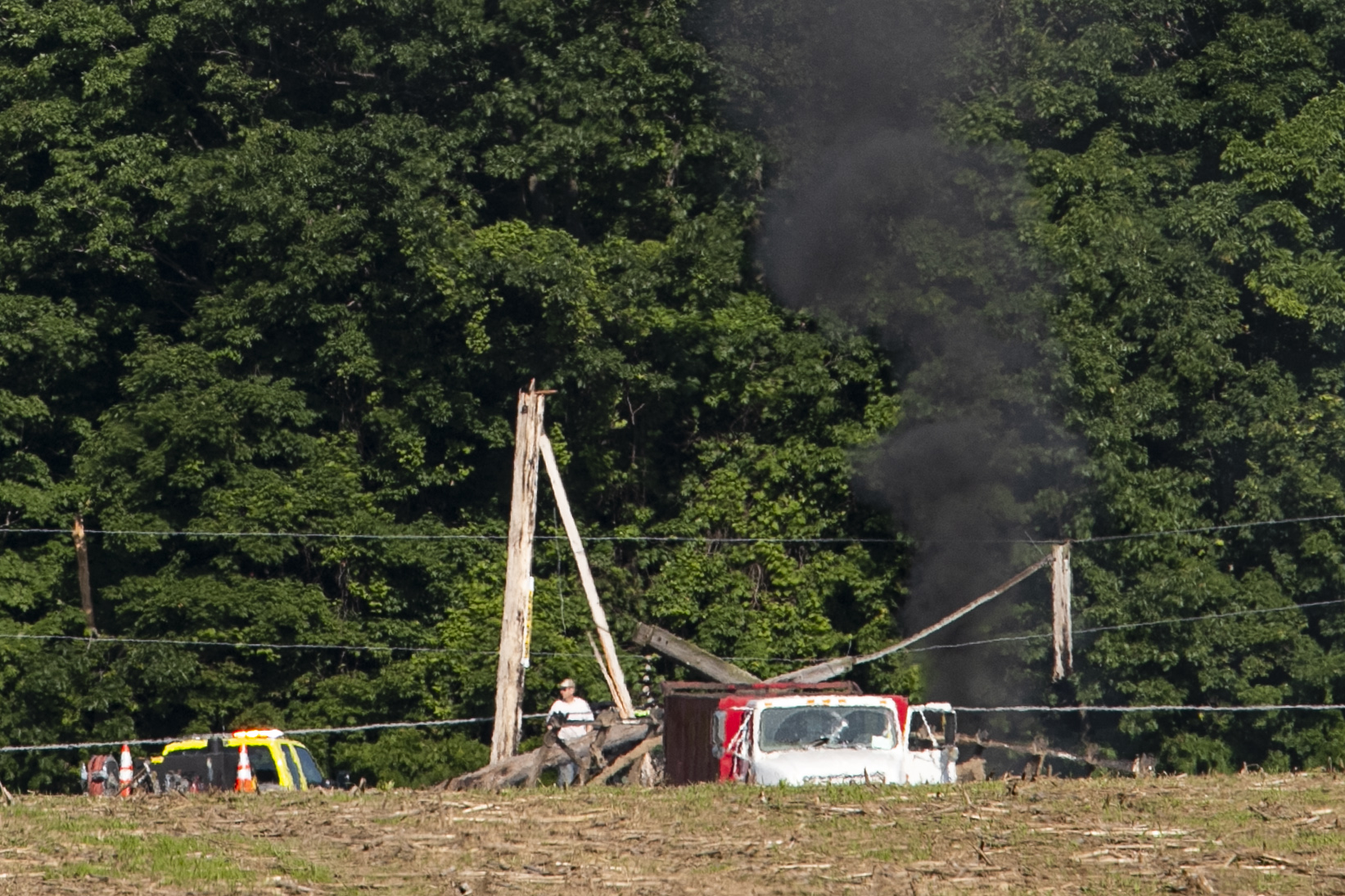 Farmer trapped after power lines fall on tractor - mlive.com