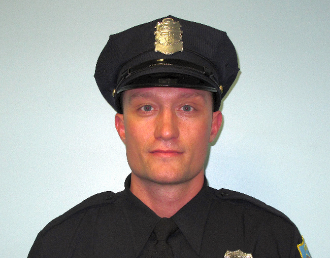 Springfield police escorted the body of deceased officer Aaron McNab ...