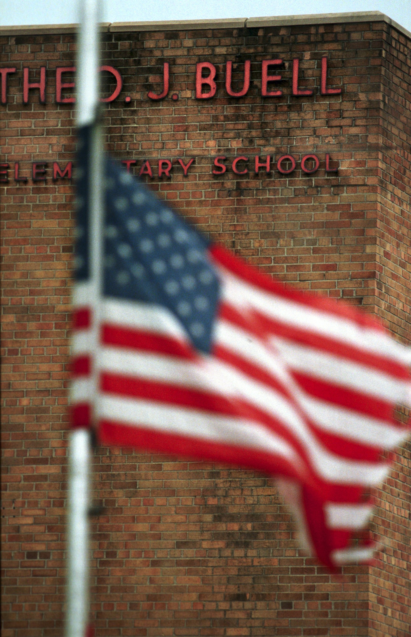 The American flag sits at half staff on March 1, 2000. (Flint Journal File Photo)