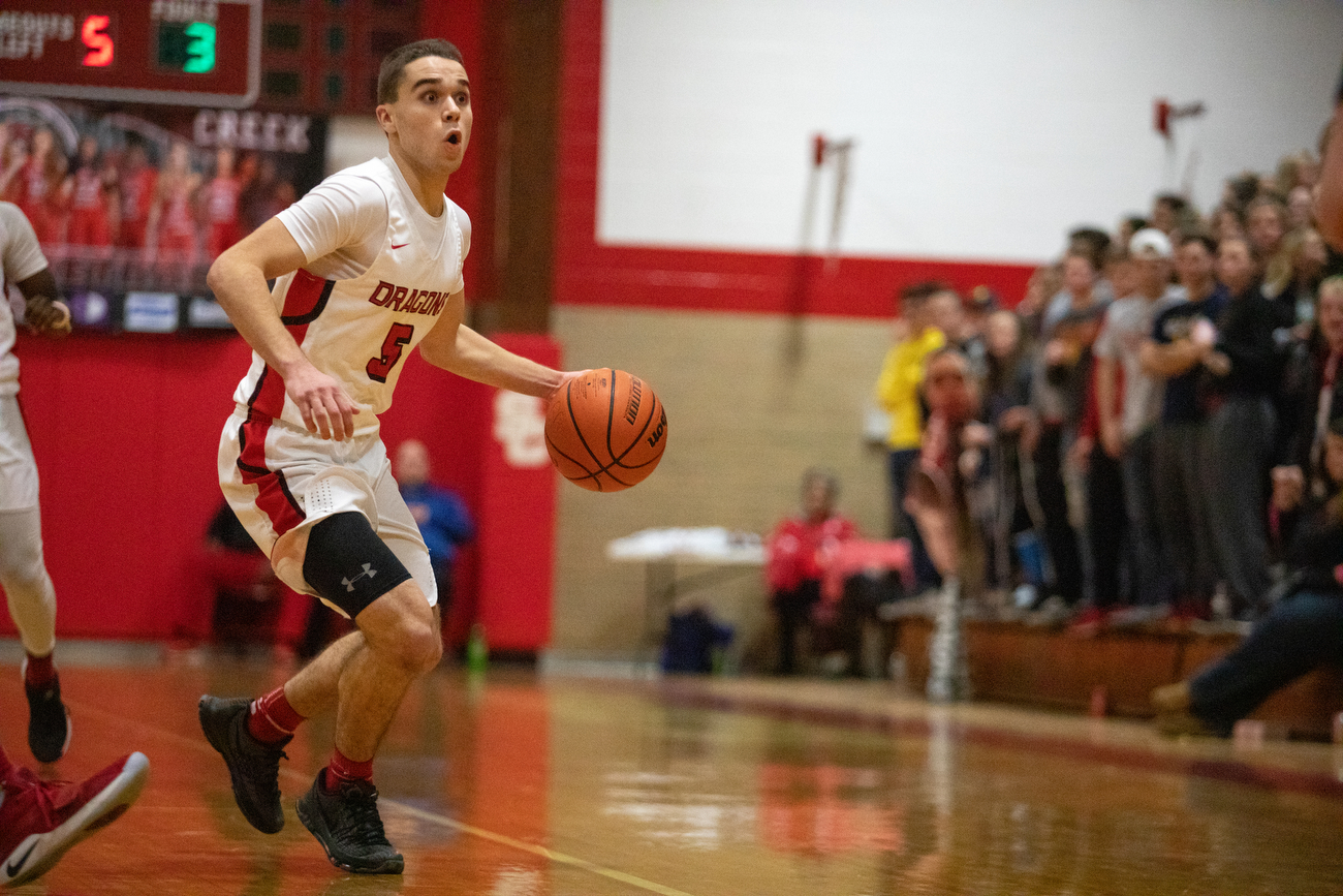 Linden boys basketball defeats Swartz Creek