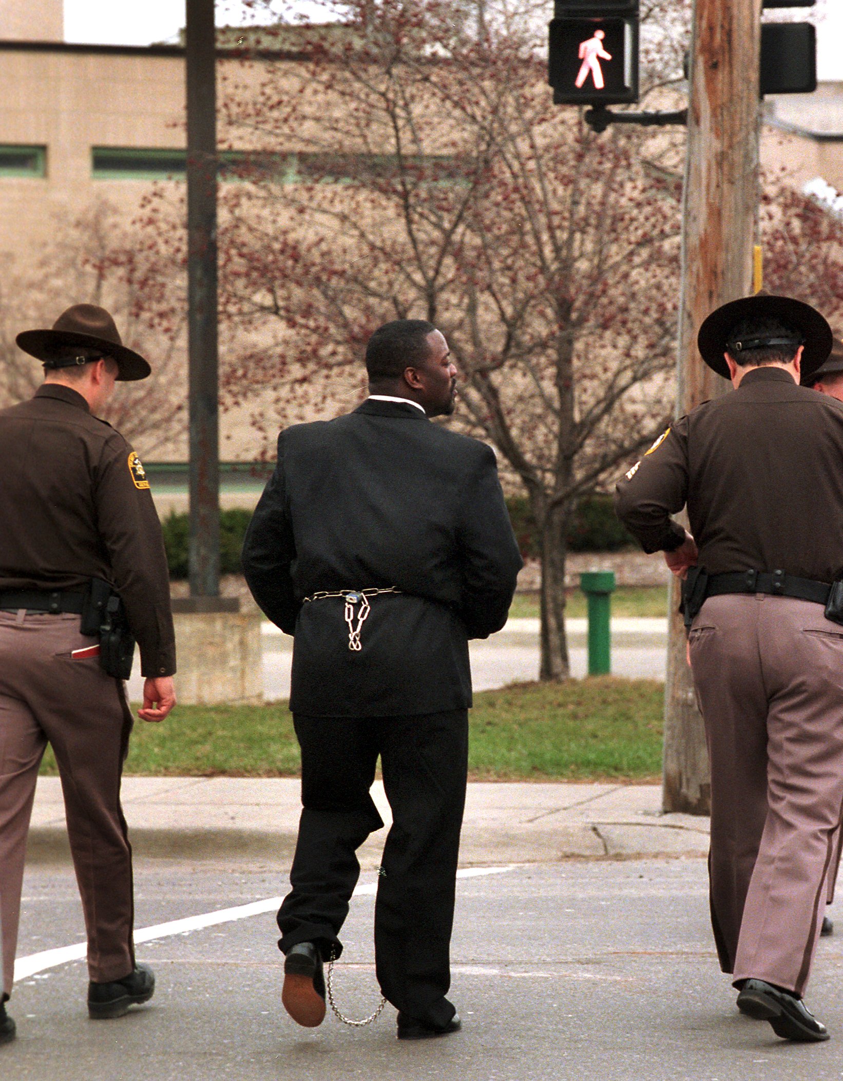 Dedric Owens is led back to county jail after participating in a neglect hearing in the family division of Genesee County Circuit Court on Tuesday March 21, 2000. (Flint Journal File Photo by Steve Jessmore)