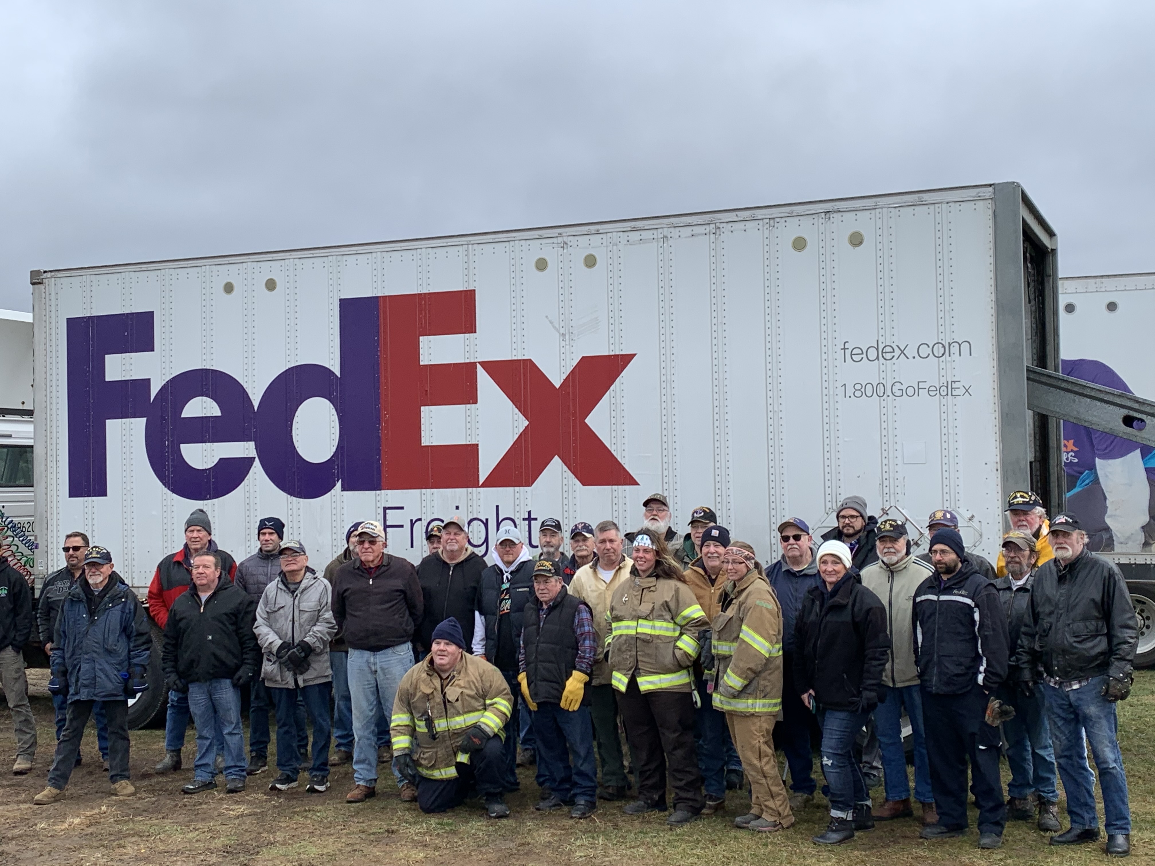 Volunteers load 500 Christmas trees for Trees for Troops at Wahmhoff