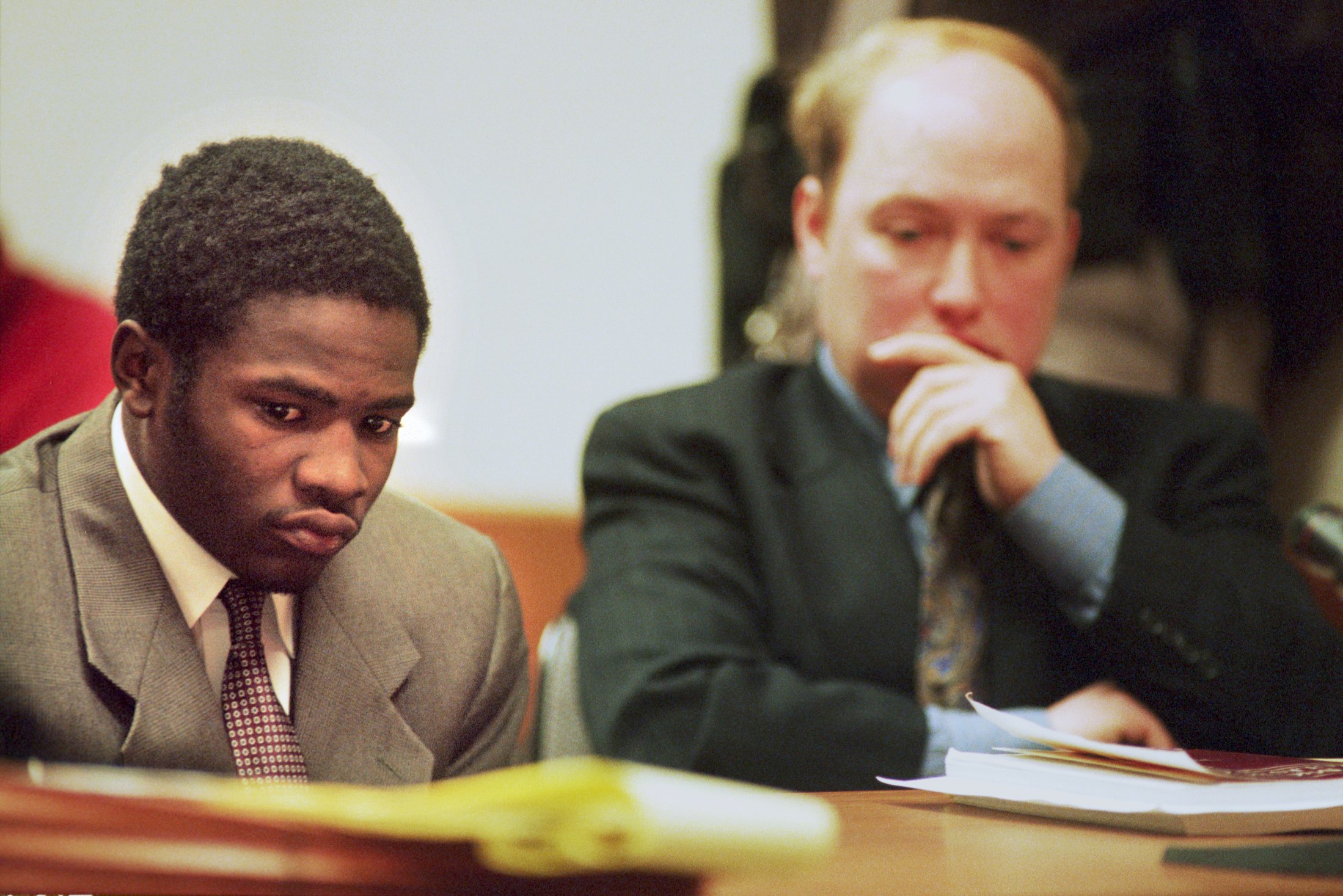 Jamelle James (left), 19, sits in a preliminary hearing in District Court on Tuesday, March 14, 2000. James is charged with involuntary manslaughter in the death of Kayla Rolland. (Flint Journal File Photo by Justin Warren)