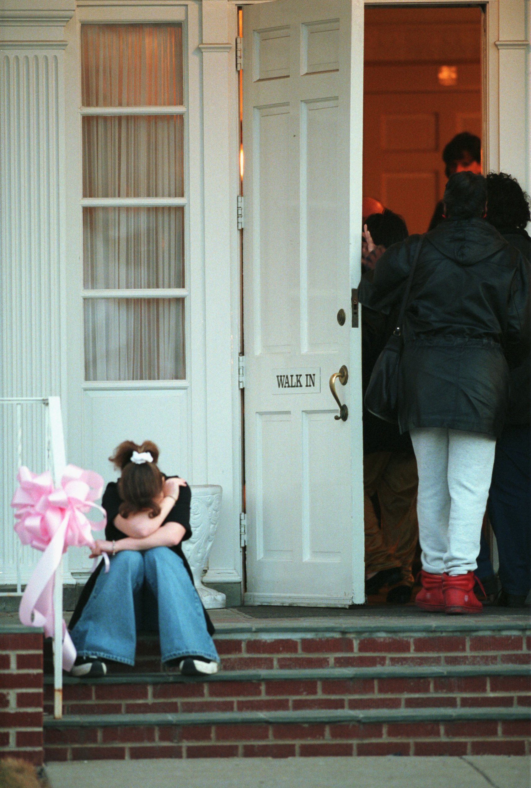 All day Friday a steady stream of mourners arrive at Brown Funeral Home on Friday, March 3, 2000 in Flint for the visitation of Kayla Rolland. (Flint Journal File Photo by Steve Jessmore)