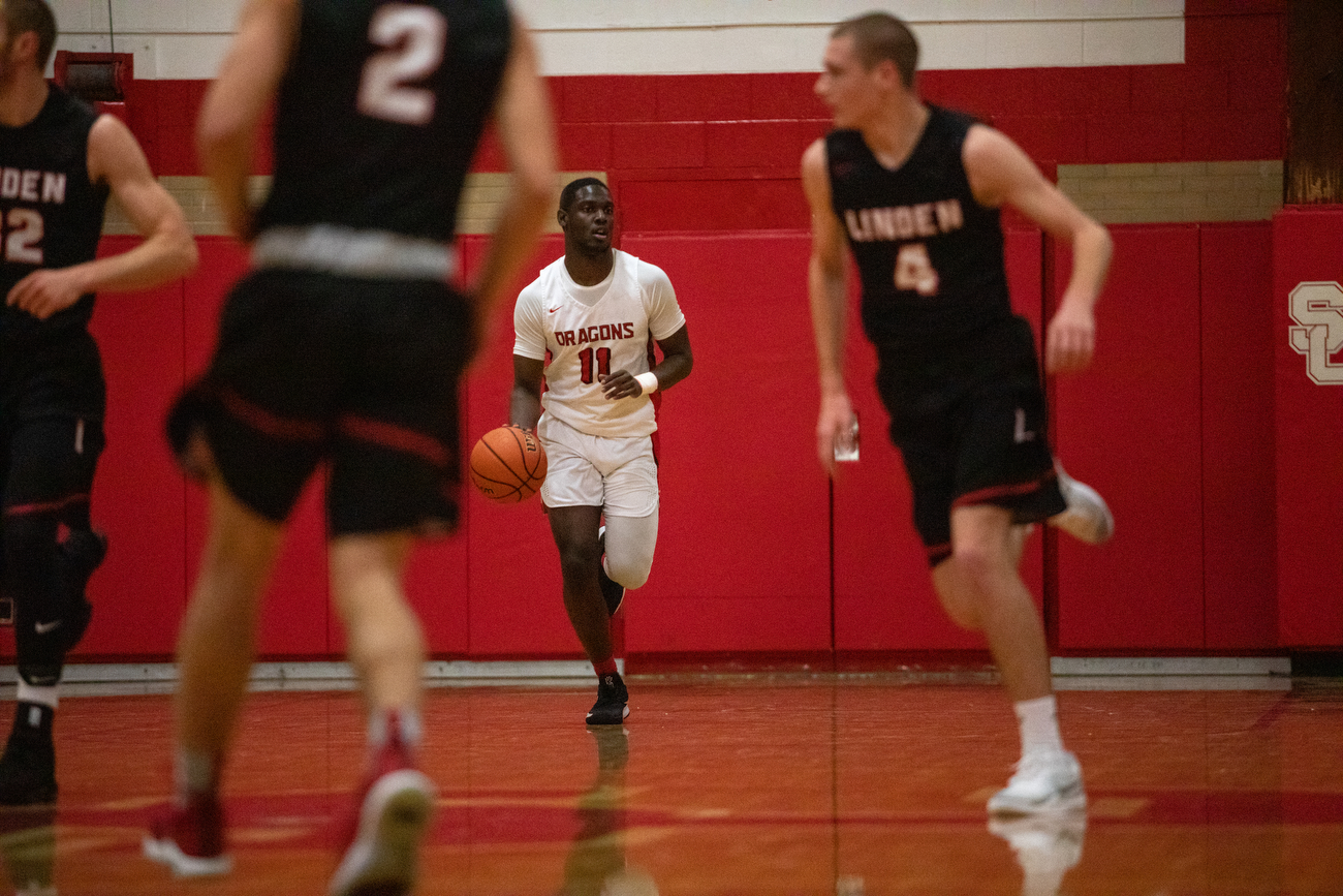 Linden boys basketball defeats Swartz Creek