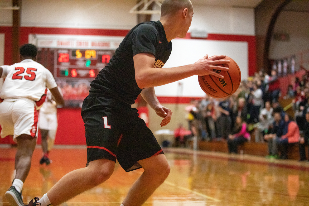 Linden boys basketball defeats Swartz Creek